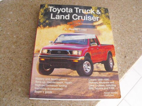 1994 Ford Bronco - This is a book cover for "Toyota Truck & Land Cruiser" a red Toyota pickup truck.