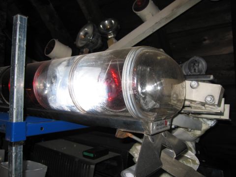 2001 Ford Crown Victoria - Close-up of an emergency light bar, likely for a vehicle, with internal red lights visible.