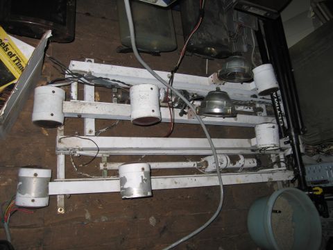 2001 Ford Crown Victoria - An industrial light fixture with several lamps and wiring is shown mounted on a metal frame.