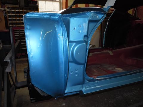 1972 Chevrolet Camaro - The side of a car, possibly a 1970s model, is shown with its door open, revealing the interior and some bodywork.