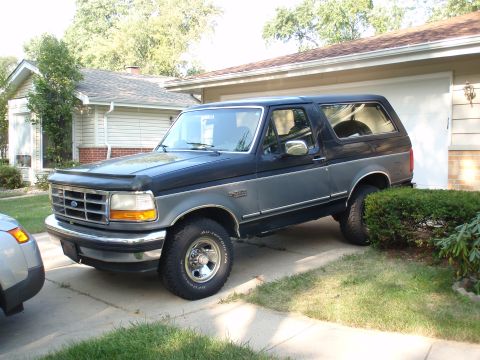 1993 Ford Bronco - This 1993 Ford Bronco is parked in front of a house.