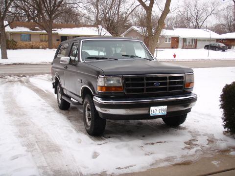 1993 Ford Bronco - A 1993 Ford Bronco is parked in a driveway covered in snow.