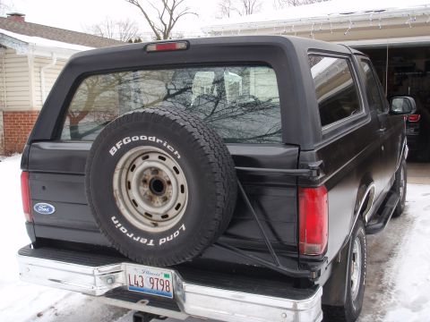1993 Ford Bronco - Rear view of a 1993 Ford Bronco showing the spare tire and tailgate.