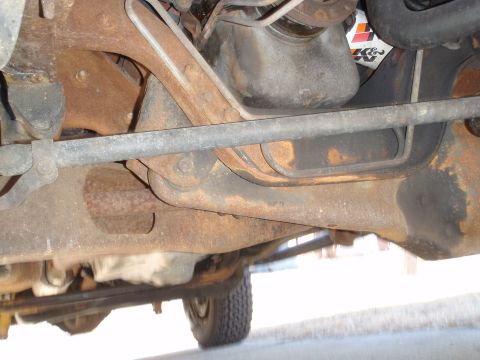 1993 Ford Bronco - Undercarriage view of a vehicle, showing suspension and engine components.