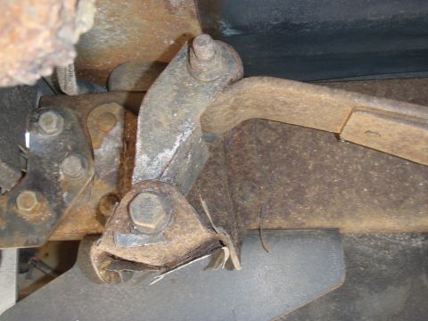 1993 Ford Bronco - Close-up view of heavily rusted suspension and frame parts, with a Supermotors.net watermark visible.
