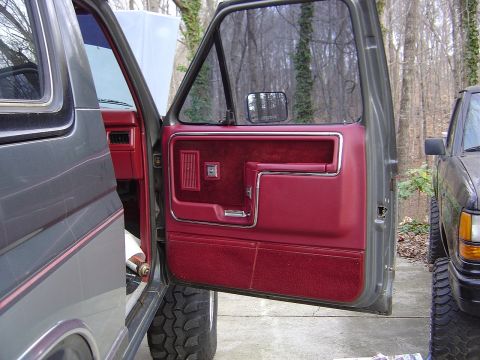 1986 Ford Bronco - Restored door panel installed with all new fasteners. Color is not dead on but it is way better than the faded pink they had become.