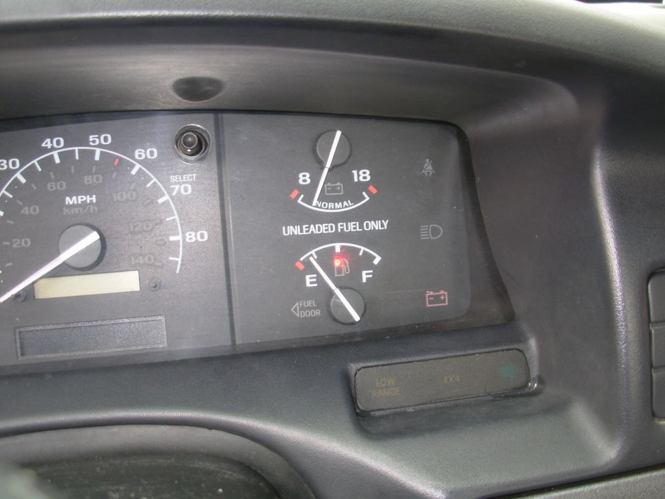 Instrument cluster with speedometer, fuel and temperature gauges