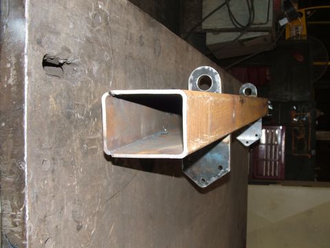 1978 Ford Bronco - A custom metal bracket, possibly for towing or lifting, is shown attached to a workbench.