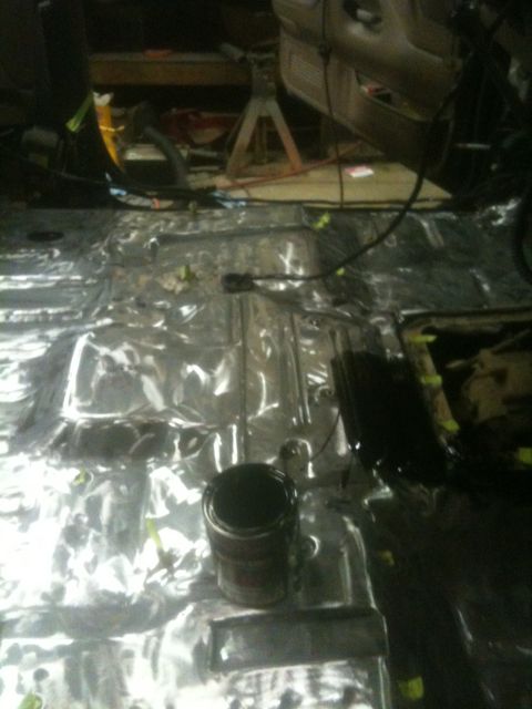1993 Ford Bronco - Vehicle interior floor being prepped with sound deadening material and wiring.