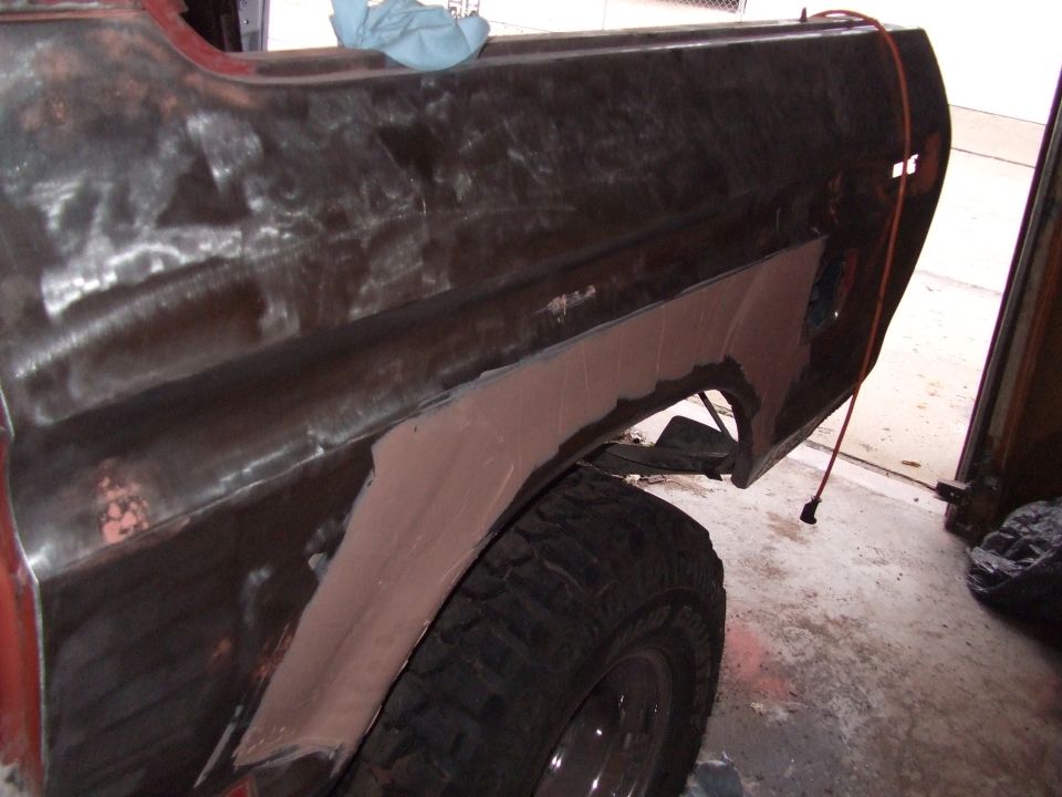 1979 Ford Bronco rear fender with body filler and exposed metal