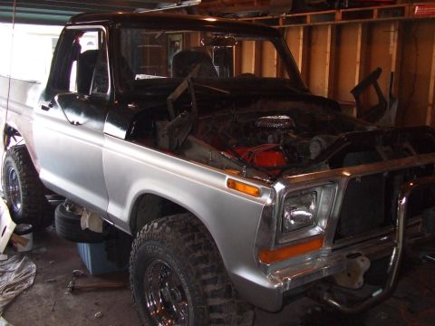 1979 Ford Bronco - This 1979 Ford Bronco is undergoing work in a garage, showing its engine bay.
