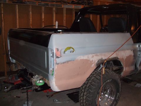 1979 Ford Bronco - This 1978 Ford Bronco is in a garage, undergoing repairs and bodywork on its rear quarter panel.