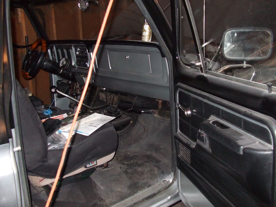 Interior view of a 1979 Ford Bronco showing the dashboard, steering wheel, and driver's seat
