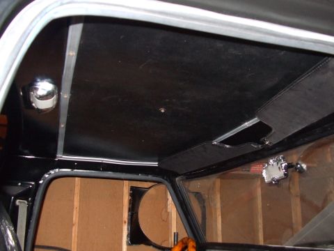1979 Ford Bronco - Interior shot of a vehicle, focusing on the headliner and window area.
