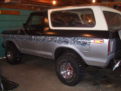 1979 Ford Bronco - This 1979 Ford Bronco features a two-tone paint scheme with skull graphics along the lower body.