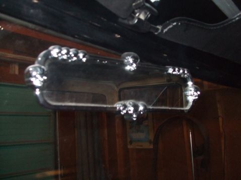 1979 Ford Bronco - The chrome trim on the interior rearview mirror has a decorative beaded edge.