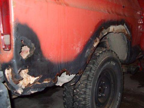 1979 Ford Bronco - This 1979 Ford Bronco displays significant rust damage on its rear quarter panel, a common issue for vehicles of this era.