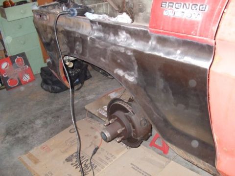 1979 Ford Bronco - 1979 Ford Bronco bodywork in progress, with brake assembly visible.
