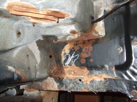 1979 Ford Bronco - This image shows a heavily rusted section of a vehicle's frame, not a complete vehicle.
