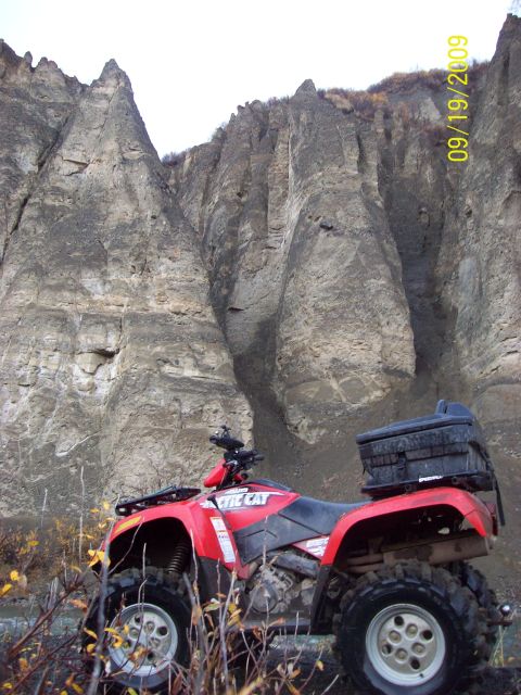 1986 Chevrolet Blazer - An ATV is parked in front of a large rock formation. The date 09/19/2009 is visible.