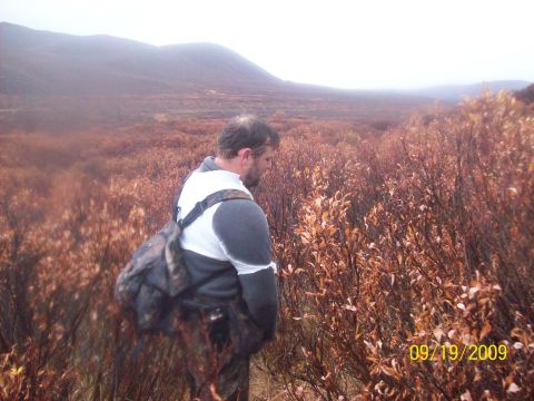 1986 Chevrolet Blazer - Man in a field of brush with hills under an overcast sky. The photo is dated 09/19/2009.