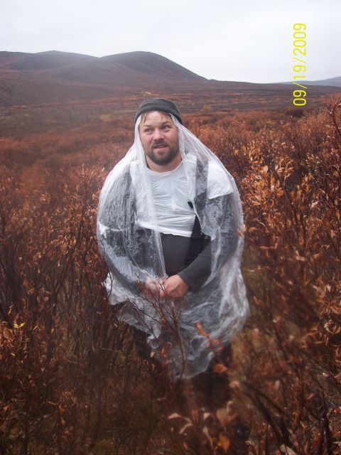 1986 Chevrolet Blazer - A man stands in a brushy landscape wearing a clear poncho. The photo was taken on September 19, 2009.