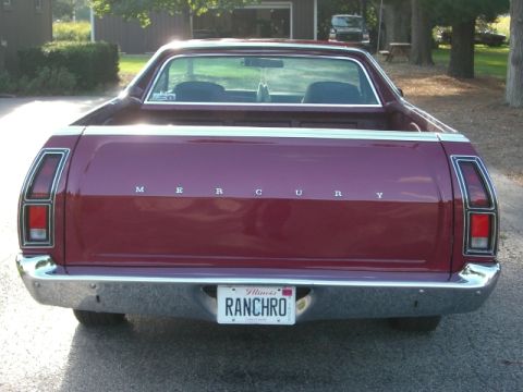 1972 Ford Ranchero - This Mercury Ranchero is seen from the rear, with a custom license plate and another vehicle in the background.