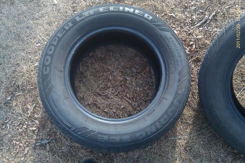 2000 Mercury Grand Marquis - Two tires are visible, one is a Cooper Lifeliner Touring tire.