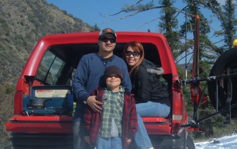 1988 Ford Bronco - Family poses in the back of a red 1988 Ford Bronco during an outdoor trip.