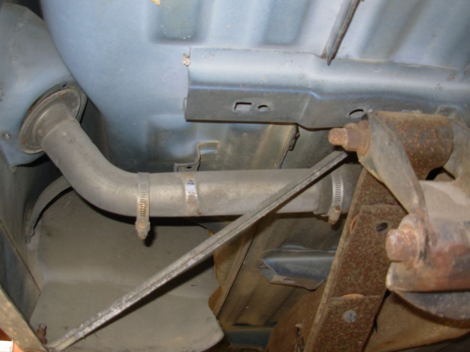 Undercarriage view of transmission and exhaust pipe