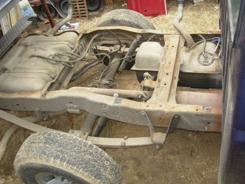 1995 Ford F-150 - Even though I put a safety strap under the suspended bed, I rolled the chassis out to work on the tanks. Go to the NEXT pic...