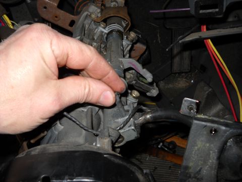 1993 Ford C-150 (Centurion Conversions) - Close-up of a vehicle's steering column assembly, showing mechanical parts and wiring.