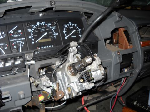 1993 Ford C-150 (Centurion Conversions) - The steering column assembly is exposed, revealing wiring and mechanical components within the dashboard.