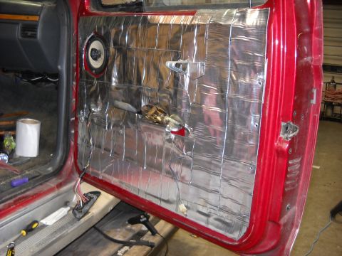 1993 Ford C-150 (Centurion Conversions) - The interior door panel is covered in sound deadening material, with a speaker installed.