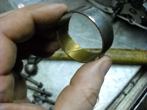 1993 Ford C-150 (Centurion Conversions) - A close-up shows a worn bearing race, likely from a transmission rebuild.