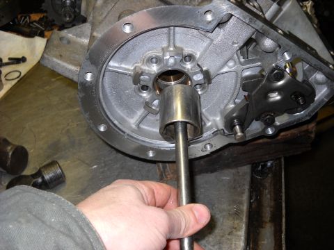 1993 Ford C-150 (Centurion Conversions) - Close-up of a transmission component being serviced with a tool.