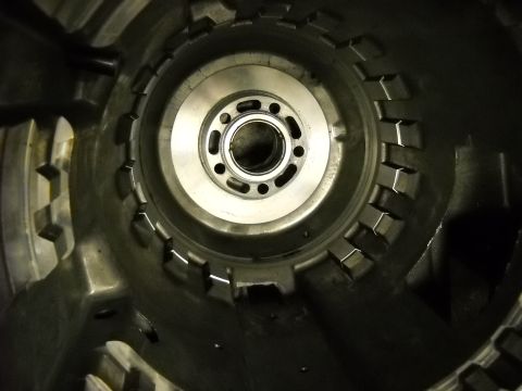 1993 Ford C-150 (Centurion Conversions) - Close-up view of the interior of a transmission torque converter housing, showing a bearing and bolt hole pattern.