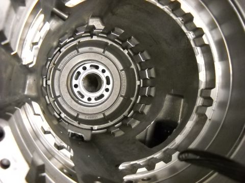1993 Ford C-150 (Centurion Conversions) - Transmission torque converter housing interior, showing internal components and a stamped part number.