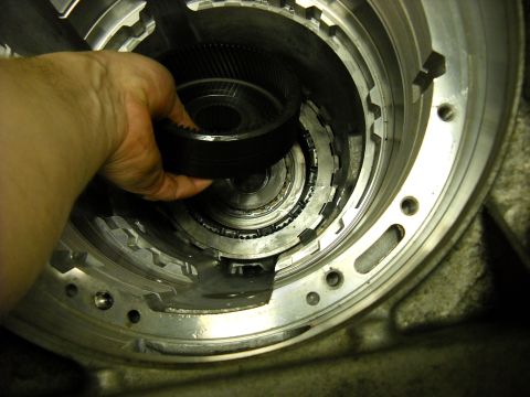 1993 Ford C-150 (Centurion Conversions) - Close-up view of internal transmission components during a rebuild process.