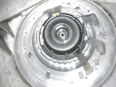 1993 Ford C-150 (Centurion Conversions) - Interior view of an automatic transmission torque converter housing, likely during a rebuild.