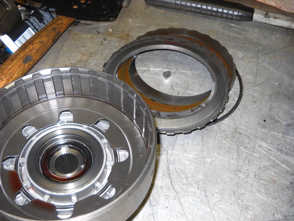 Transmission drum and ring gear on a metal workbench