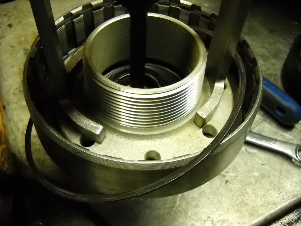 Transmission part being worked on with a tool