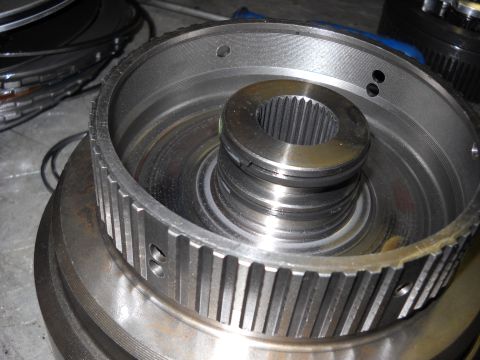 1993 Ford C-150 (Centurion Conversions) - A close-up view of a transmission component, showing a splined shaft within a toothed ring, possibly related to an E4OD rebuild.