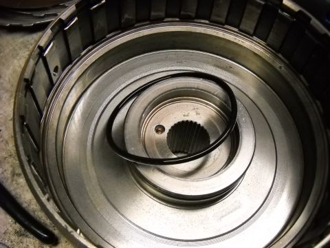 1993 Ford C-150 (Centurion Conversions) - Transmission drum with a rubber seal ring, likely part of an E4OD rebuild.