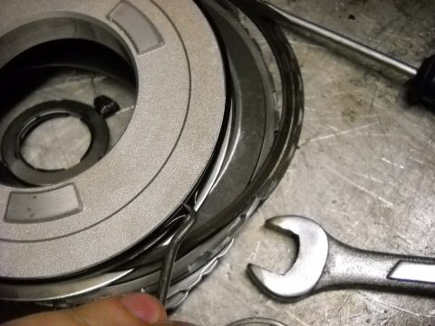 1993 Ford C-150 (Centurion Conversions) - A transmission clutch pack is being worked on with tools present.