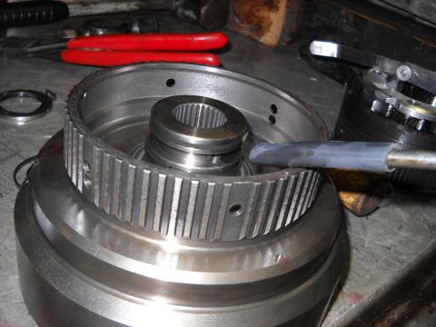 1993 Ford C-150 (Centurion Conversions) - A close-up view of a transmission component, possibly during a rebuild or repair process.