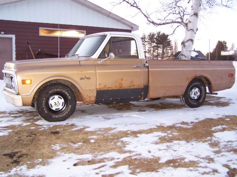 1969 Chevrolet C/K Pickup - This 1969 Chevrolet C/K Pickup truck is seen from the side in a snowy environment.