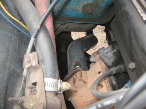 1972 Ford F-250 - Engine bay detail showing hoses and exhaust manifold connections.