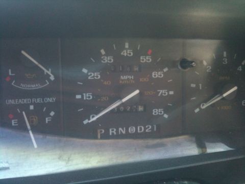 1993 Ford Taurus - The vehicle's dashboard displays the fuel level, oil status, speed, and mileage.