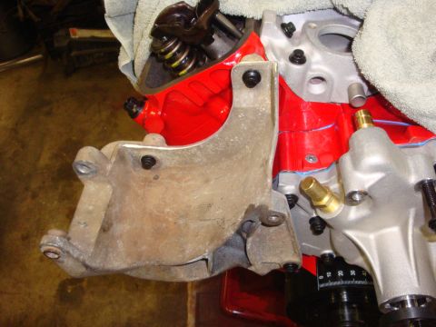 1989 Ford Bronco - Engine bracket installation detail, focus on the mounting hardware and engine block components.